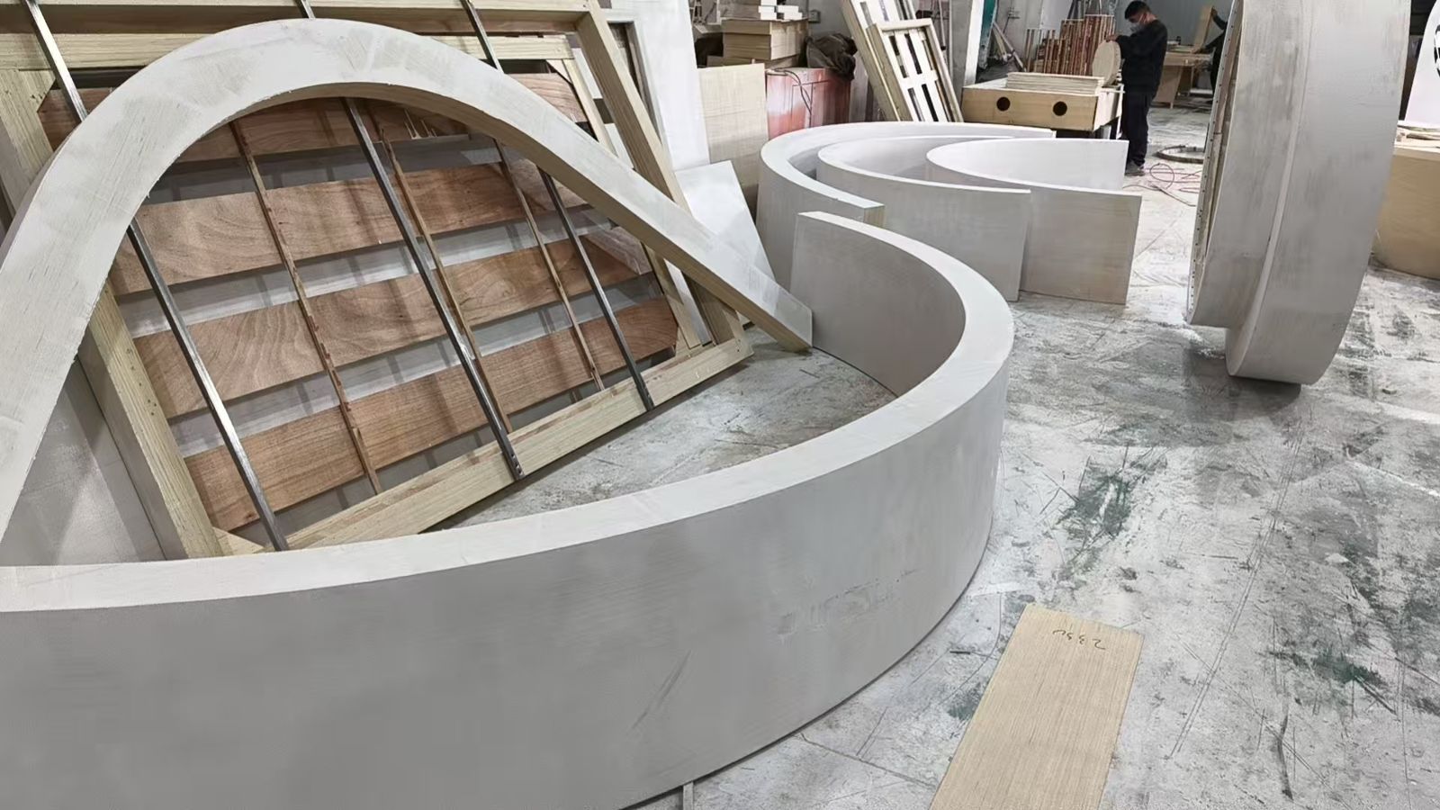 Curved booth elements being fabricated in the workshop